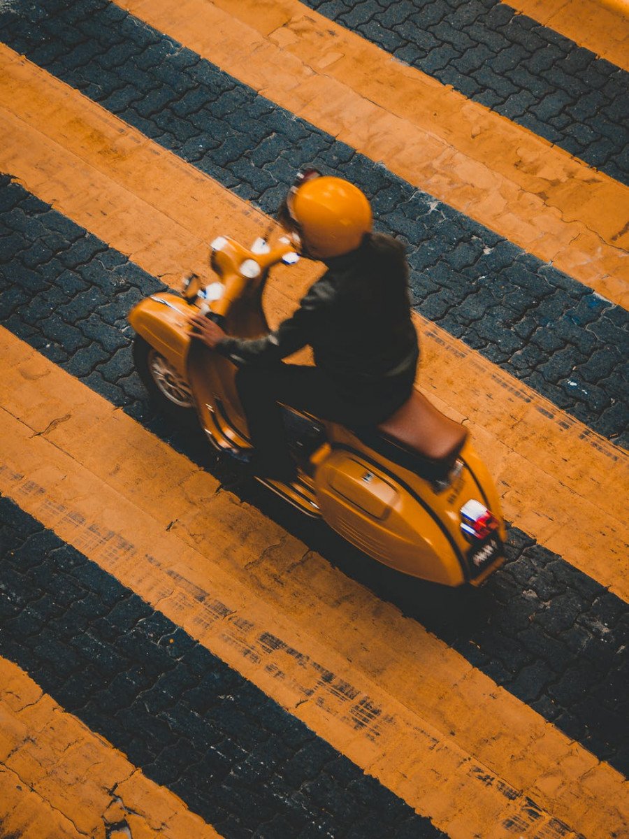 Stylish And Innovative Cycling Helmets Suitable For All In 2022 (With Photos) person riding on yellow motor scooter on road