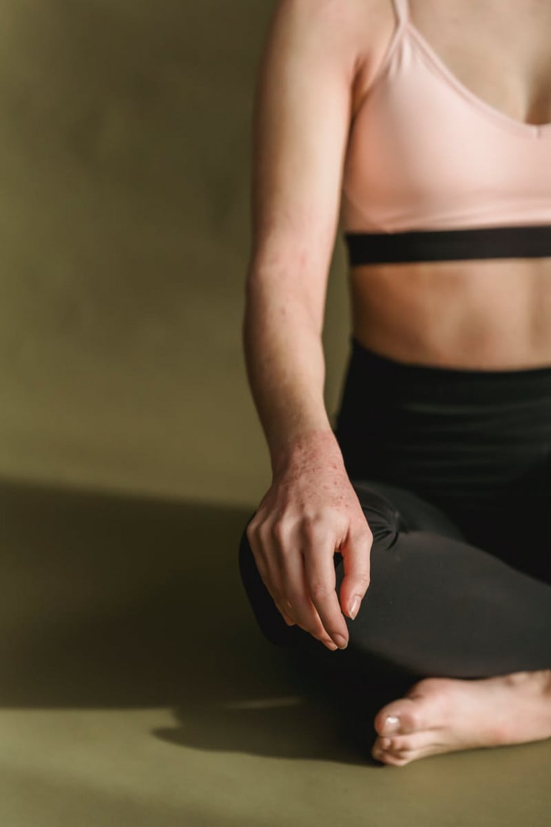 slim woman meditating in lotus position